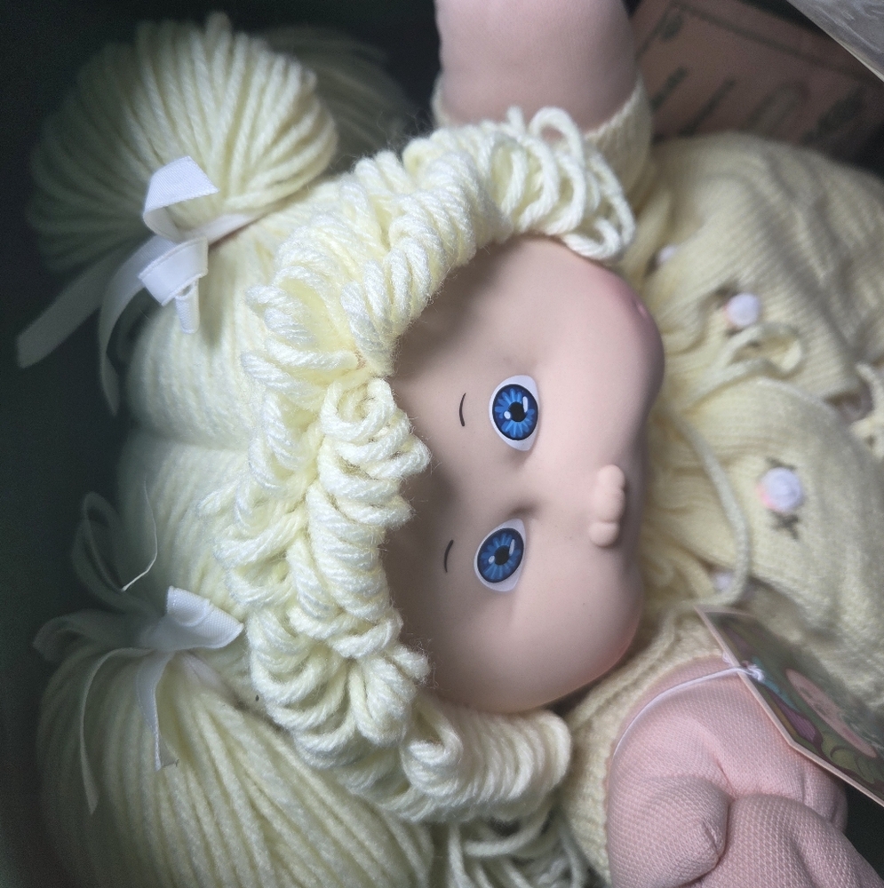 Adorable Cabbage Patch Doll with Yellow Outfit and Blue Eyes
